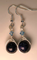 Image of a pair of earrings with round Blue Sandstone beads wrapped with silver wire and topped with blue Swarovski crystals