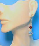 Image of an earring with 10mm AB coated spiral crystals wrapped with silver wire and topped with galaxy jasper hanging from a mannequin